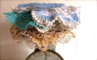 Vintage Stack of Doilies on Vintage Scale