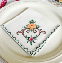 Vintage Cross-Stitched Napkin on Plate