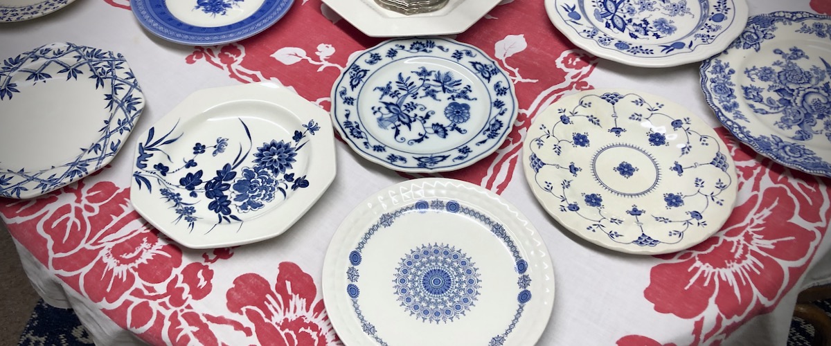 Blue & White China on a Red Patterned Tablecloth