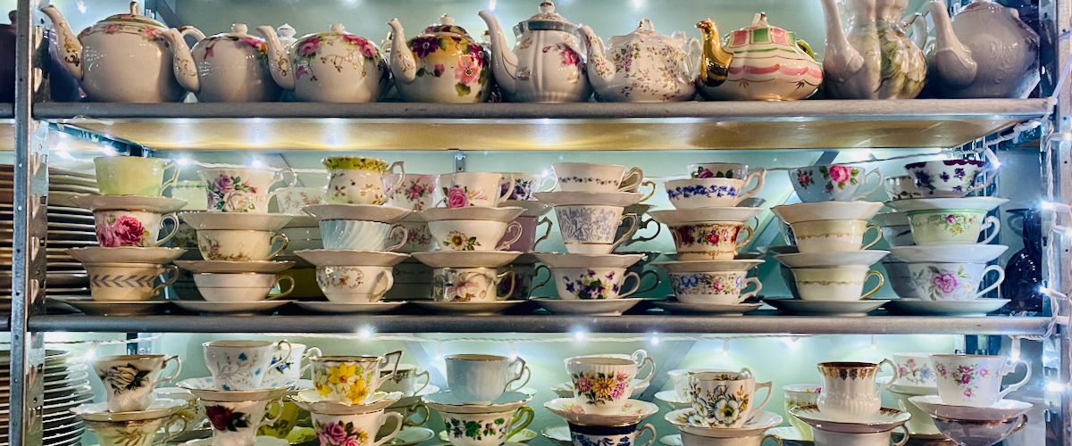 Vintage Teacups and Teapots on Shelves